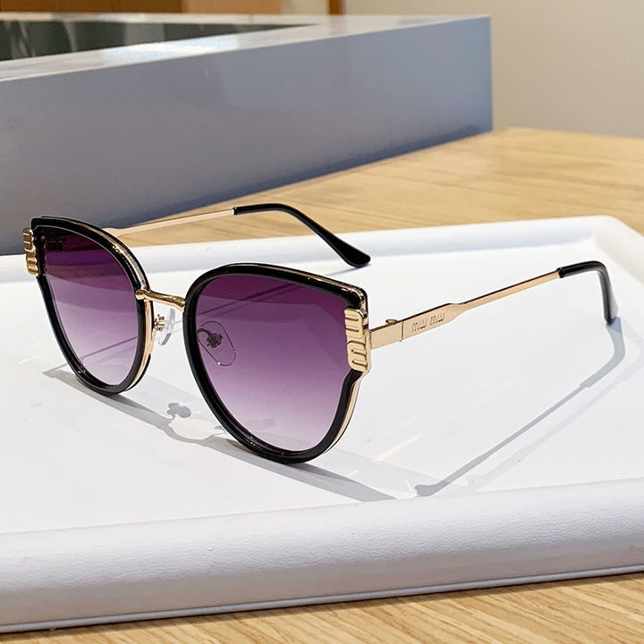 Damer Cat-Eye solbriller med elegante fremhevede linser Skanto