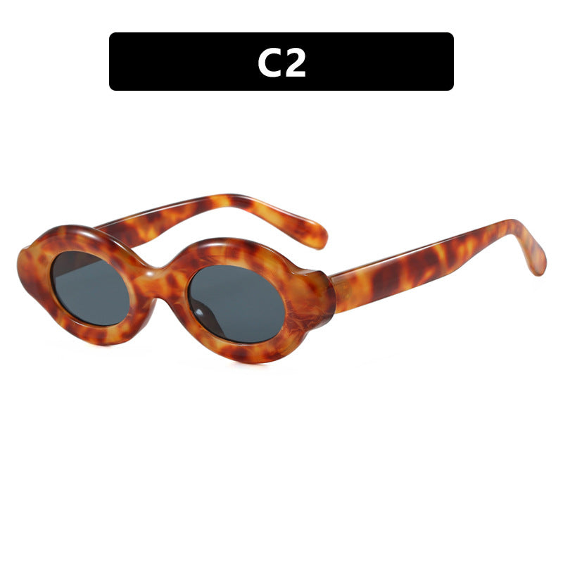 Dame solbrille i trendy retro-design med ovale glass Skanto