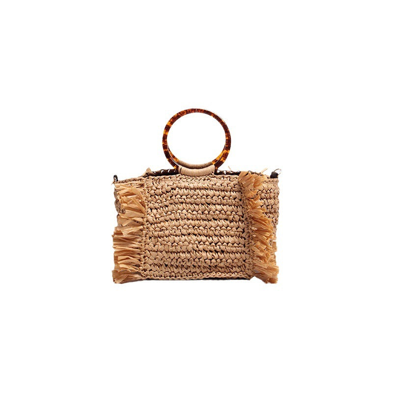 Handmade straw crossbody bag with fringe details Skanto