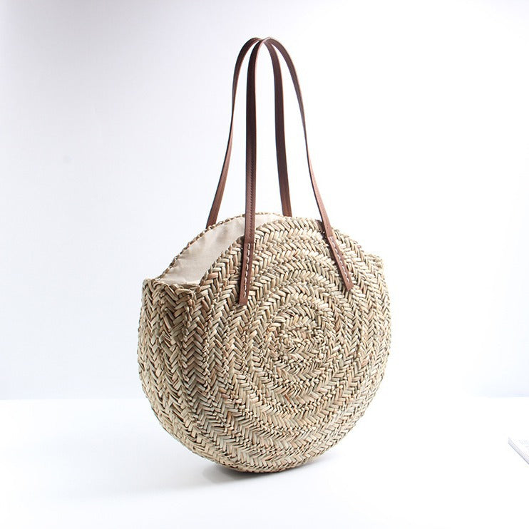 Braided straw beach bag with elegant leather handles Skanto