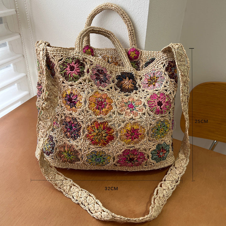 Flettet skulderveske med blomsterdesign Skanto