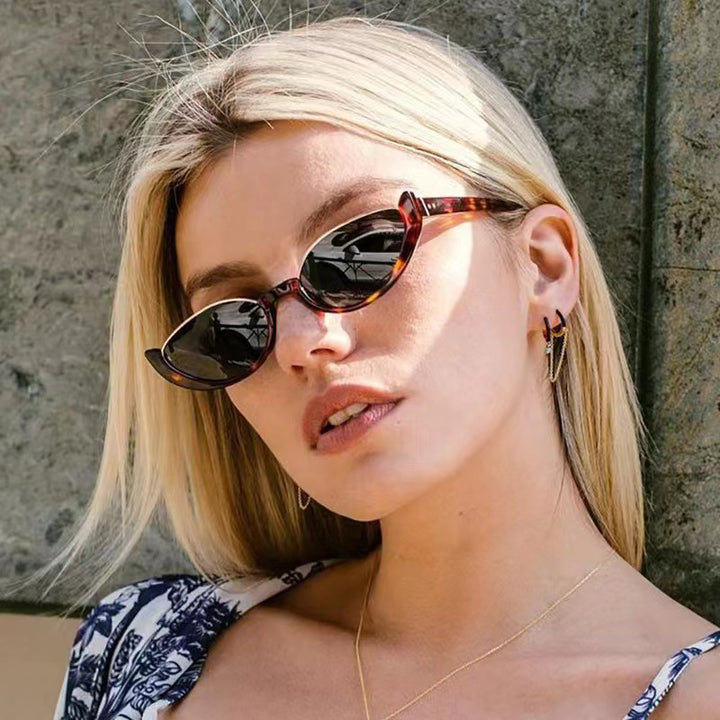 Dame Cat-Eye solbriller med diskret ramme og polarisert glass Skanto