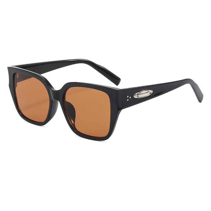 Dame solbrille i moderne kvadratisk design med klare linser Skanto