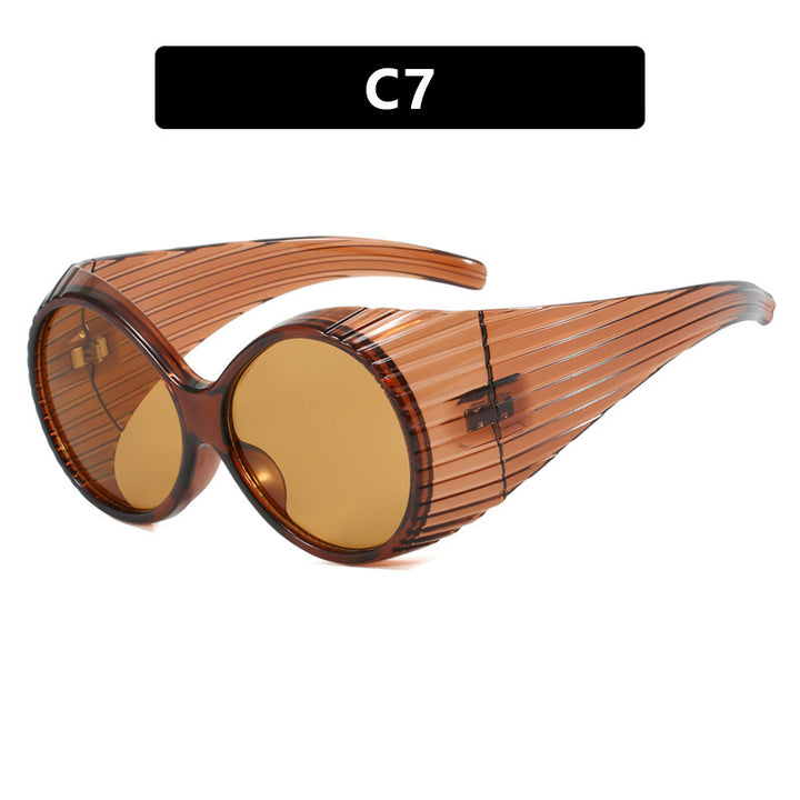 Women's extravagant sunglasses with curved frame Skanto