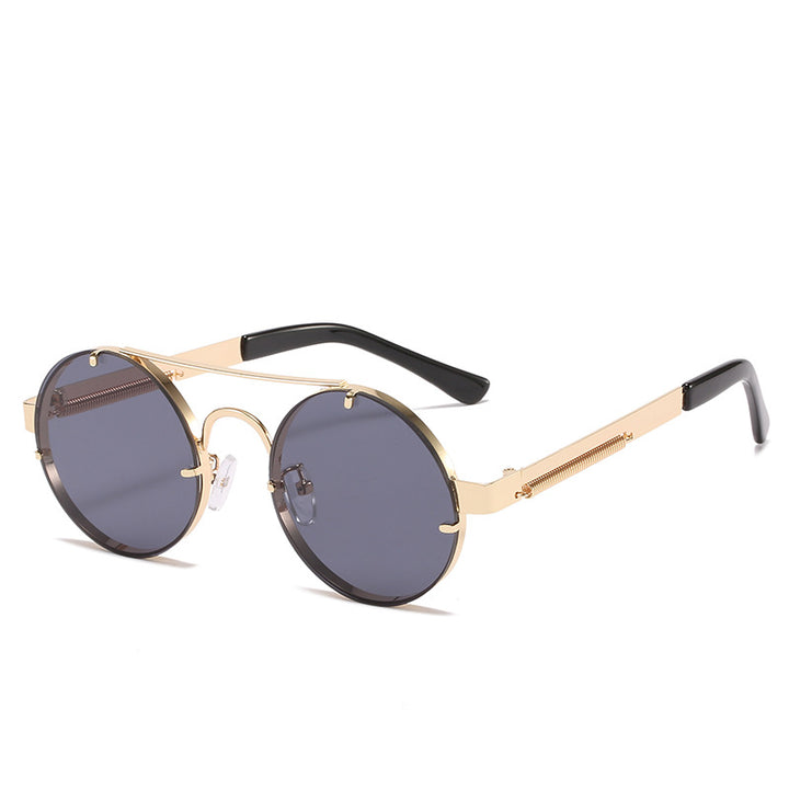 Dame rund designer solbrille med innovativ metallramme og beskyttende linser Skanto