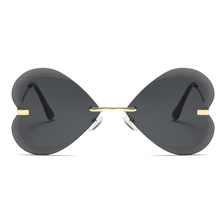 Kvinnelige hjerteformede solbriller i trendy design Skanto