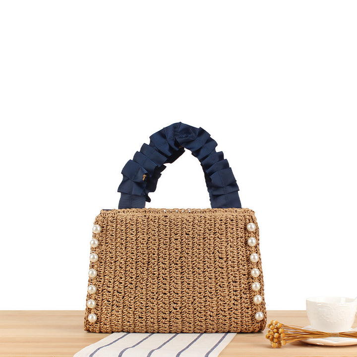 Elegant handbag with beaded decoration and ruffled handle Skanto