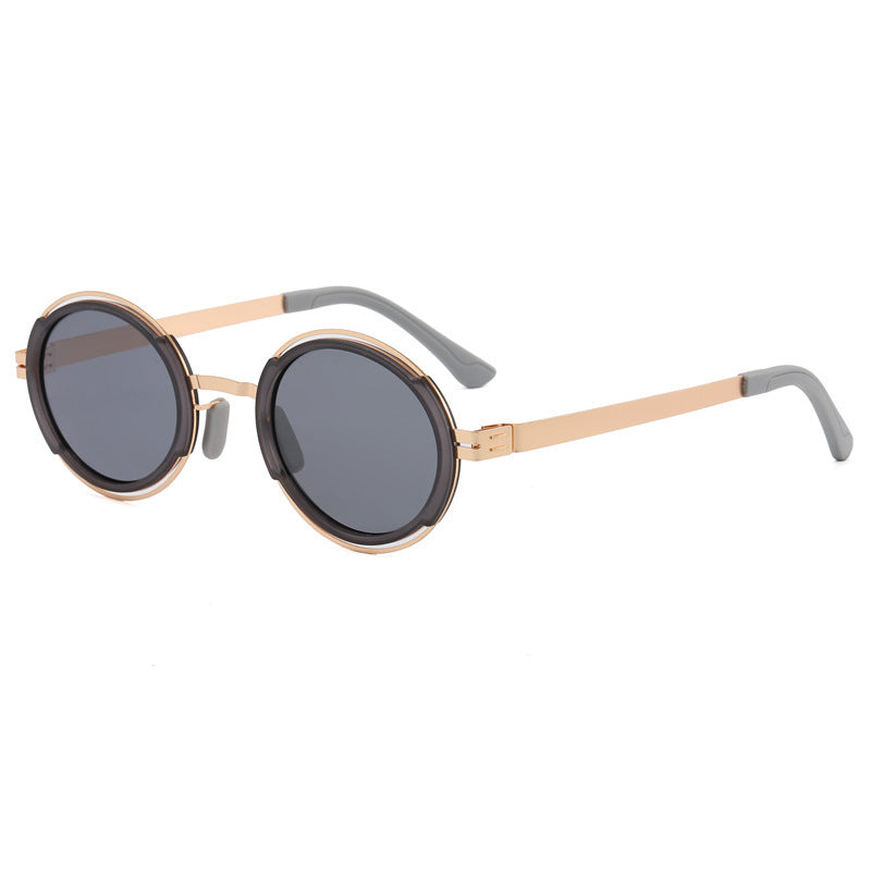 Damer moteriktig rund solbrille med elegant metallramme Skanto