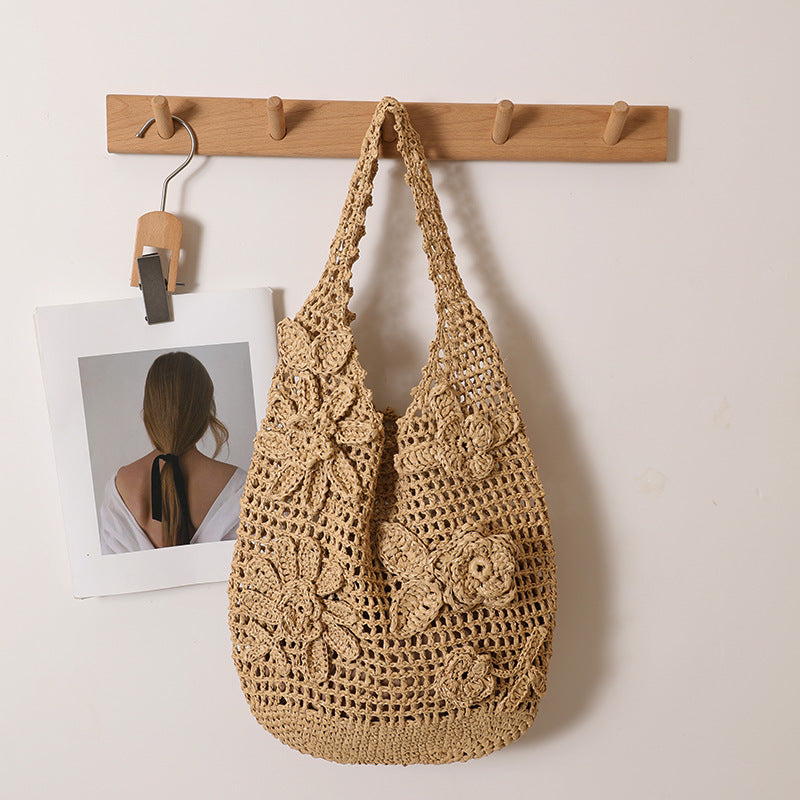 Crocheted shoulder bag with floral appliqués Skanto