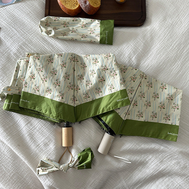 Dame elegant felle paraply med blomsterdesign Skanto