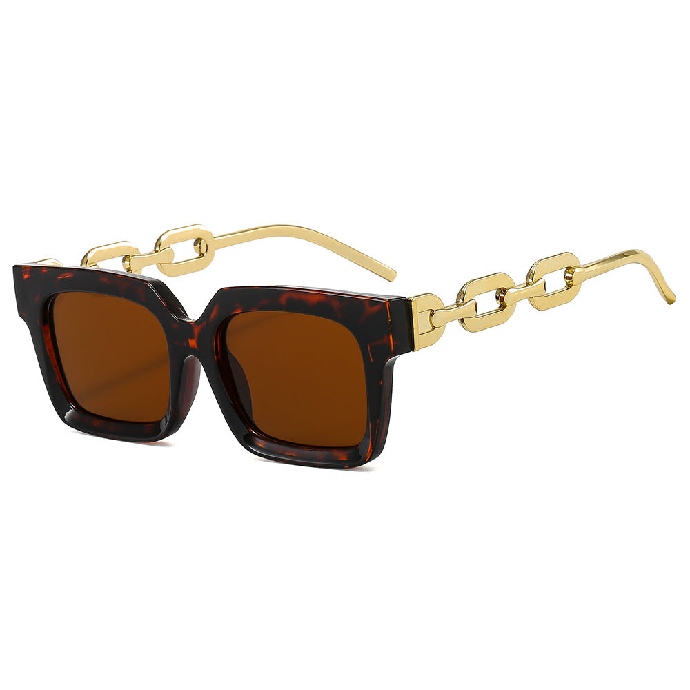 Dame moterik kvadratisk solbrille med luksuriøse kjededetaljer Skanto