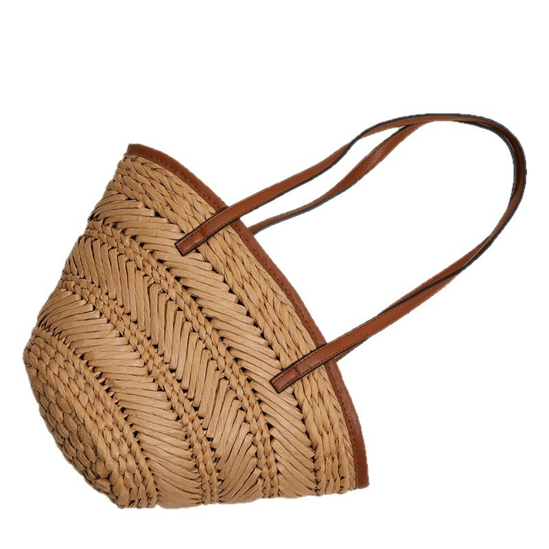 Braided basket bag with innovative leather handles Skanto