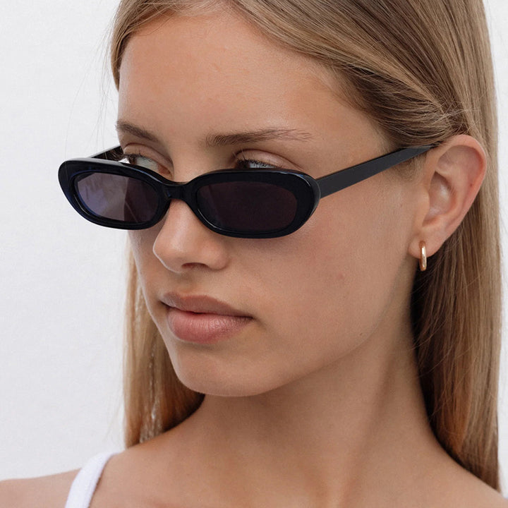 Women's fashionable cat-eye sunglasses with transparent plastic frame and UV protection Skanto