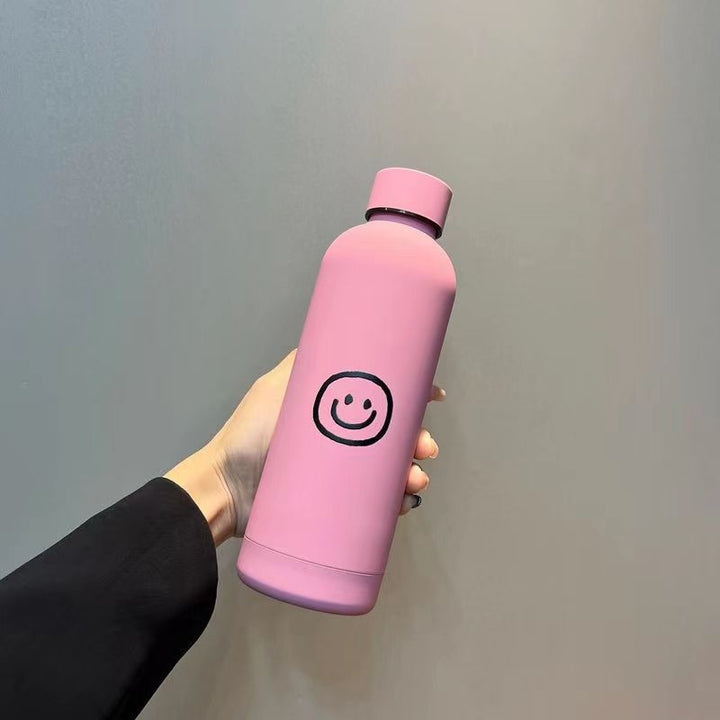 Damen Isoliertrinkflaske med lyst smilmotiv Skanto