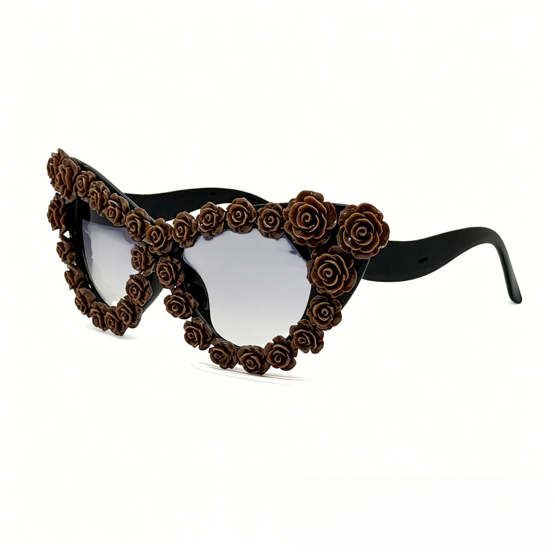 Damen hjerteformet solbrille med blomsterapplikasjon Skanto