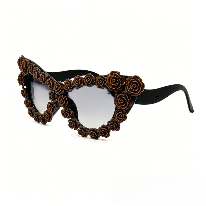 Damen hjerteformet solbrille med blomsterapplikasjon Skanto