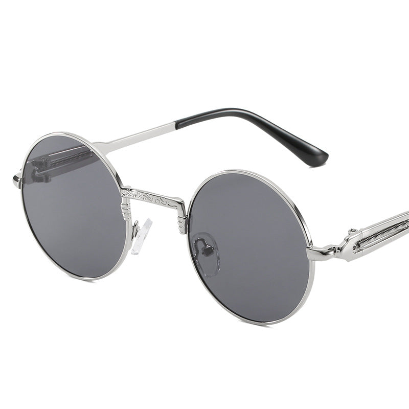 Dame rund modisk solbrille med fint metallramme Skanto