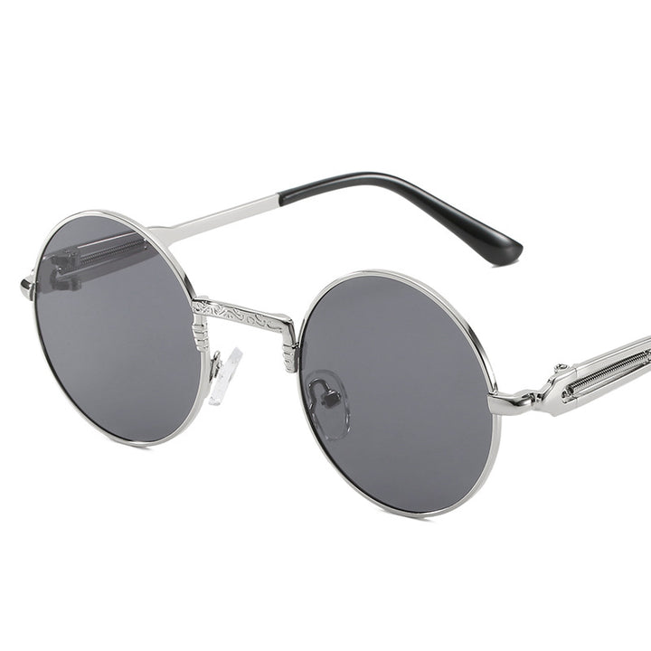 Dame rund modisk solbrille med fint metallramme Skanto