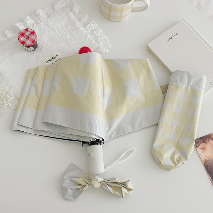 Dame sammenleggbart paraply med spesiell design Skanto