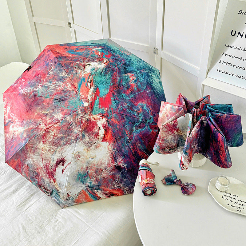 Dame sammenleggbart paraply med kreativt kunstdesign Skanto