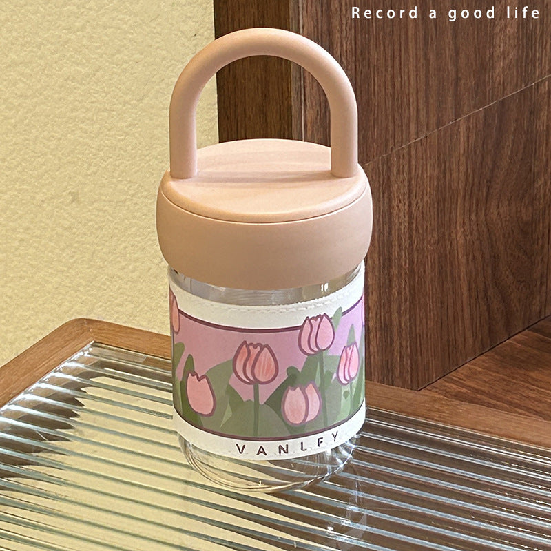 Dame isolerende drikkeflaske med ergonomisk håndtak og elegant blomsterdesign Skanto