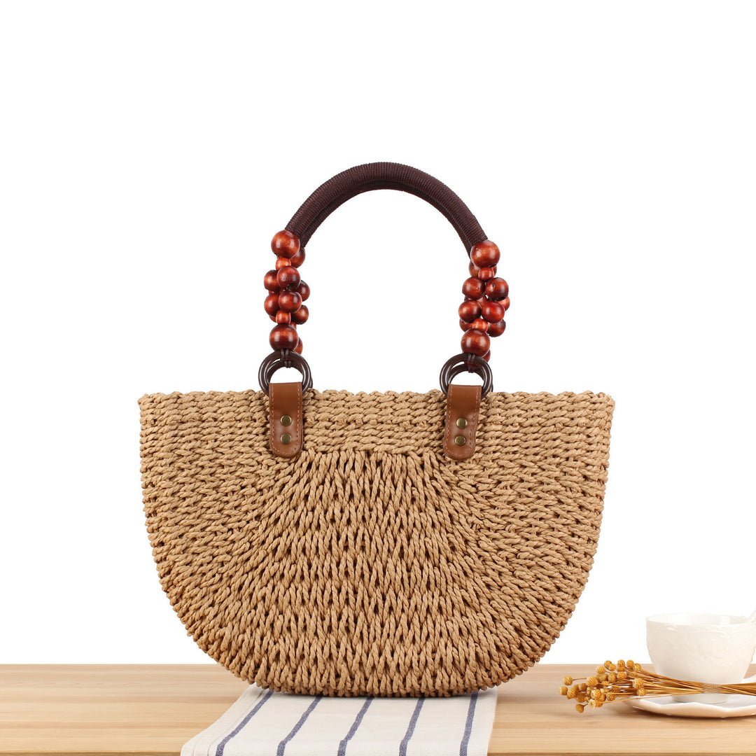 Basket bag with elegant wooden handles and textured surface Skanto