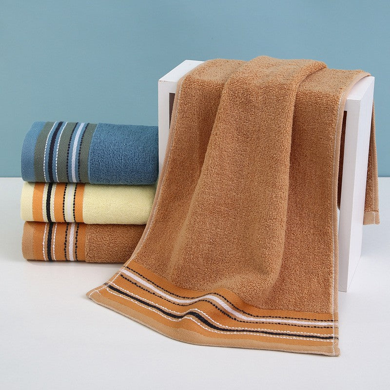 Premium Frottéhåndkle med elegant striperåndbord.