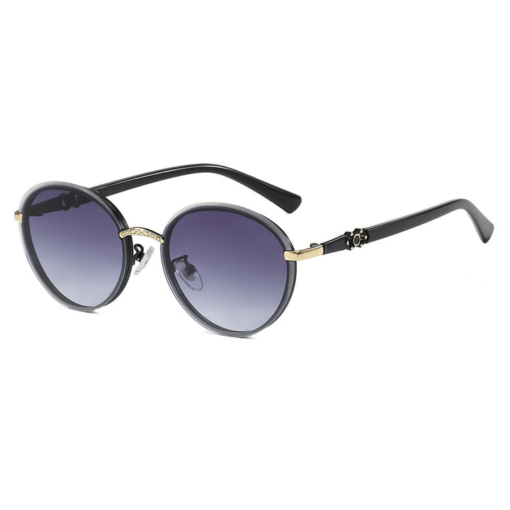 Dame elegant rund solbrille med speilende effekt Skanto