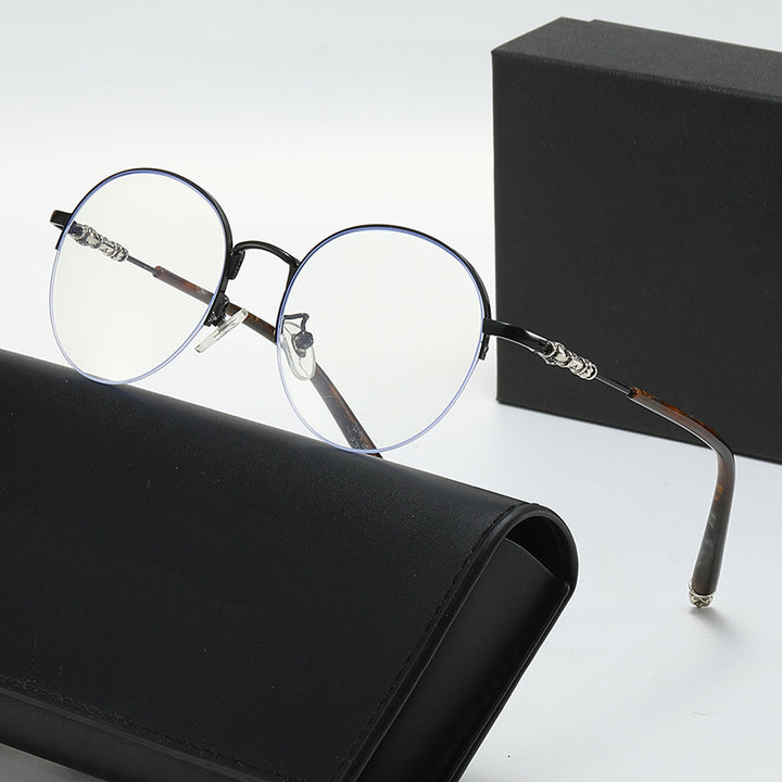 Dame rund solbrille med elegant metallramme og komfortable nesepads Skanto