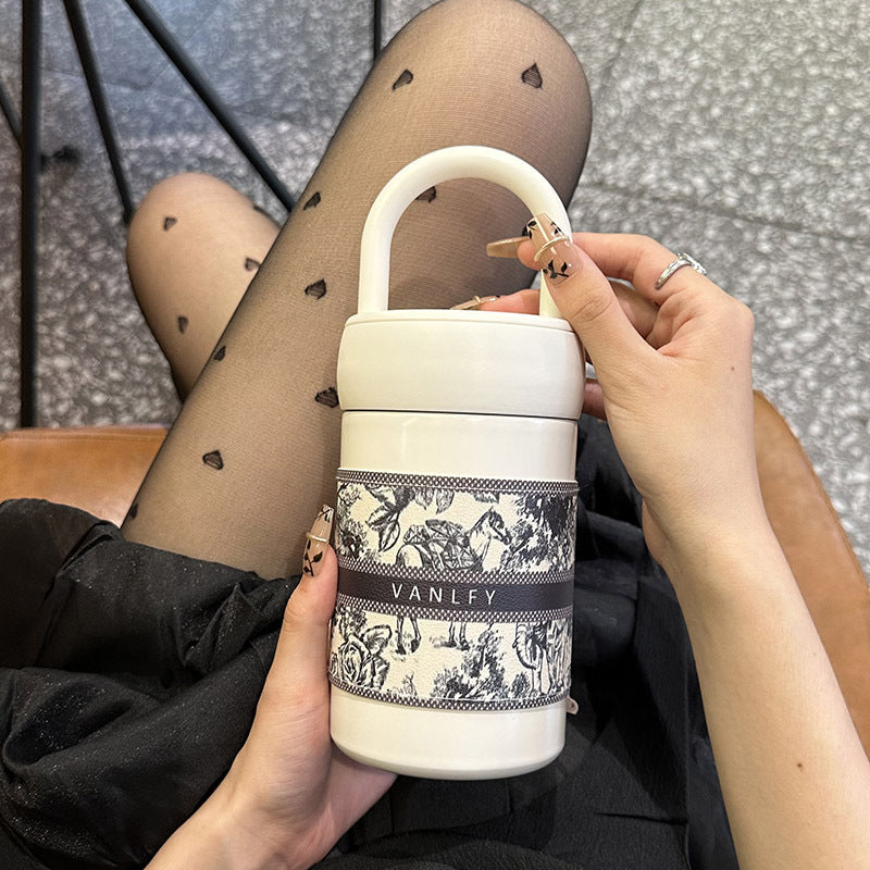 Damen stilvoller Thermobecher mit praktischem Tragegriff Skanto