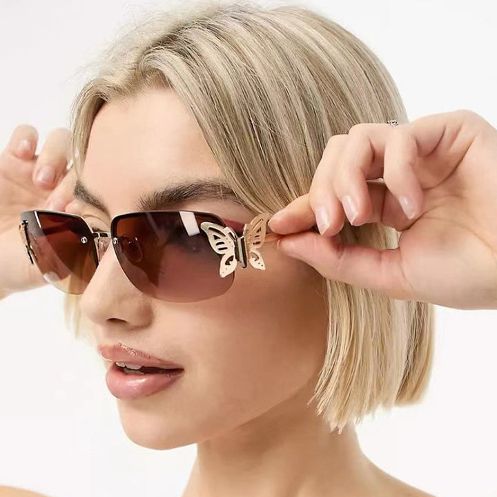 Women's fashionable sunglasses with filigree butterfly design and protective lenses Skanto