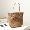 Handmade straw bag with pompom details Skanto
