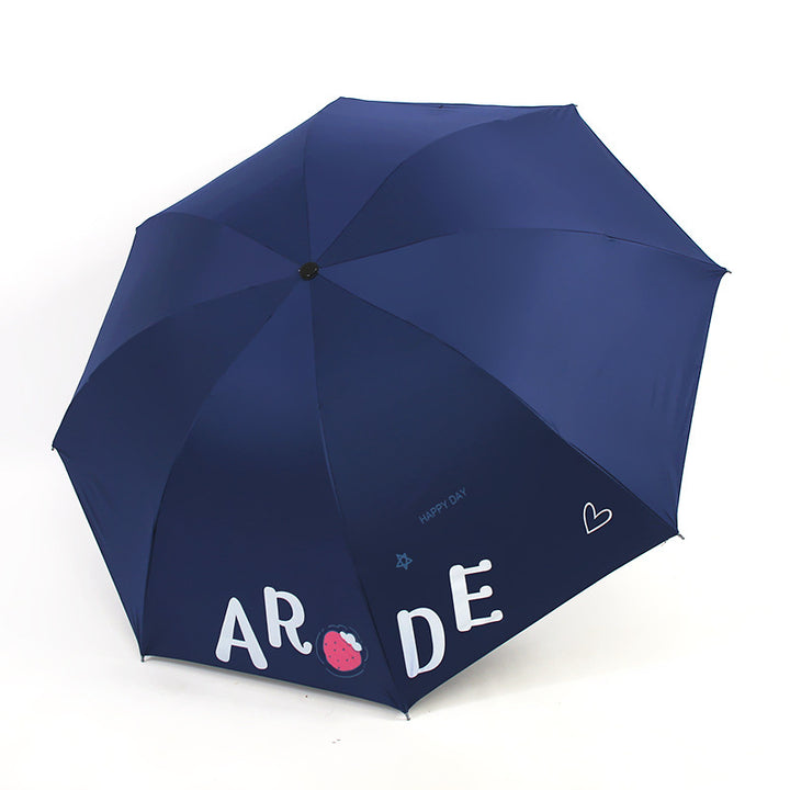 Kvinnens sammenleggbare paraply med lystig design Skanto