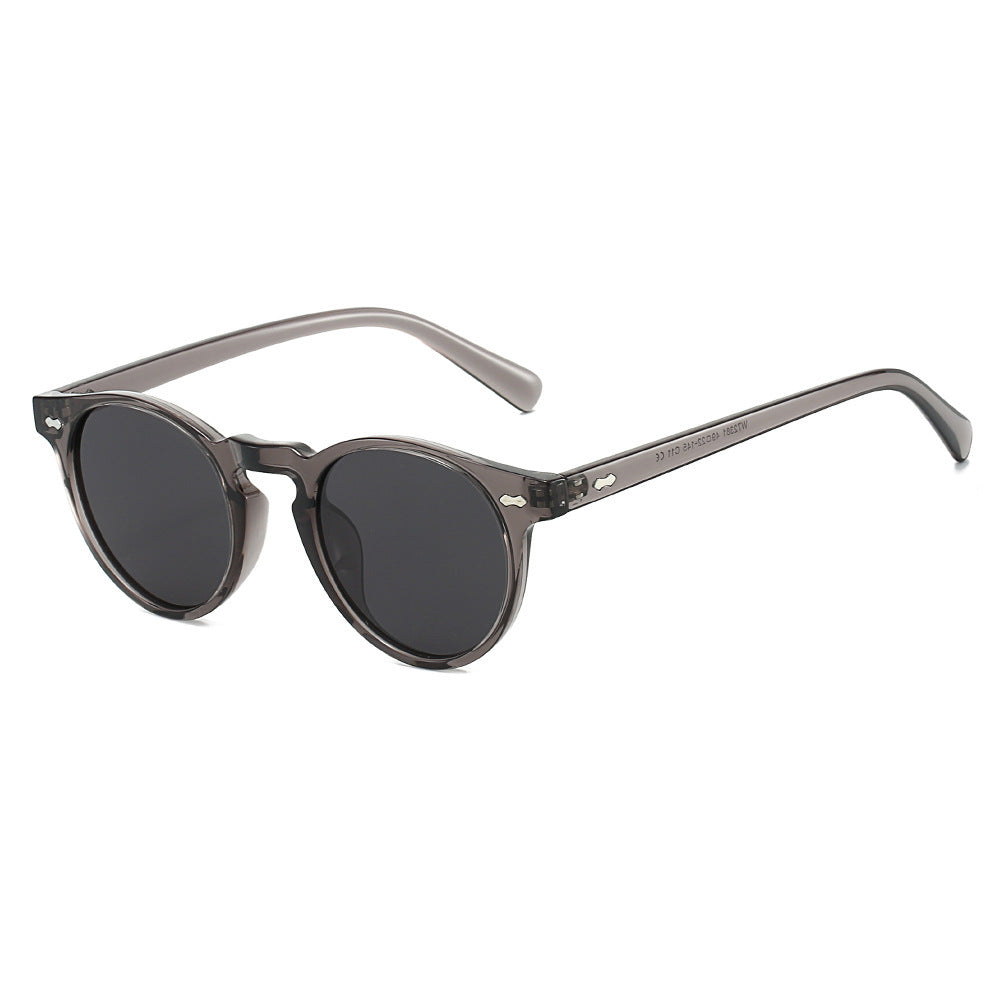 Dame vintage solbriller med runde glass og transparent ramme Skanto