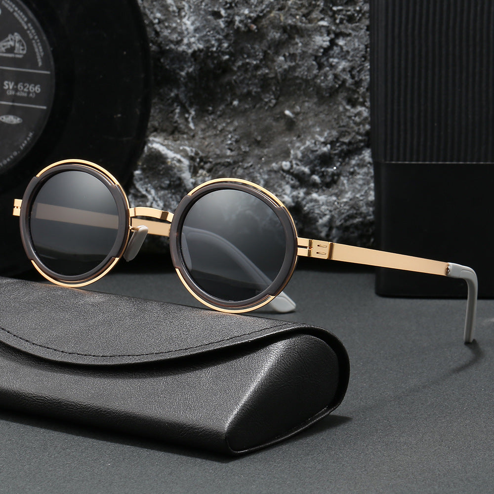 Damer moteriktig rund solbrille med elegant metallramme Skanto