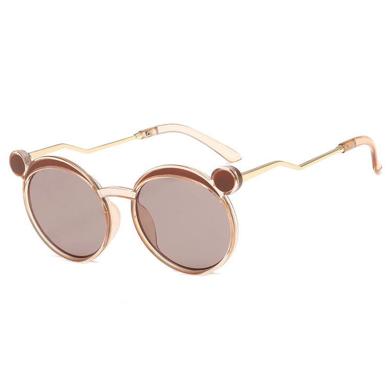 Dame Fashion-runde solbrille med innovativ ramme og fargede linser Skanto