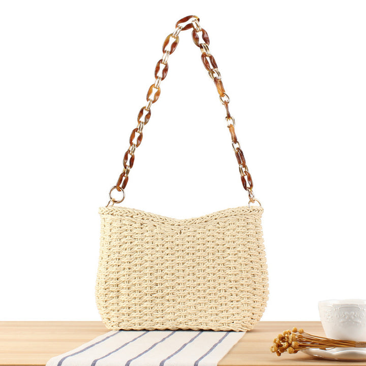 Modern straw bag with chain handle Skanto