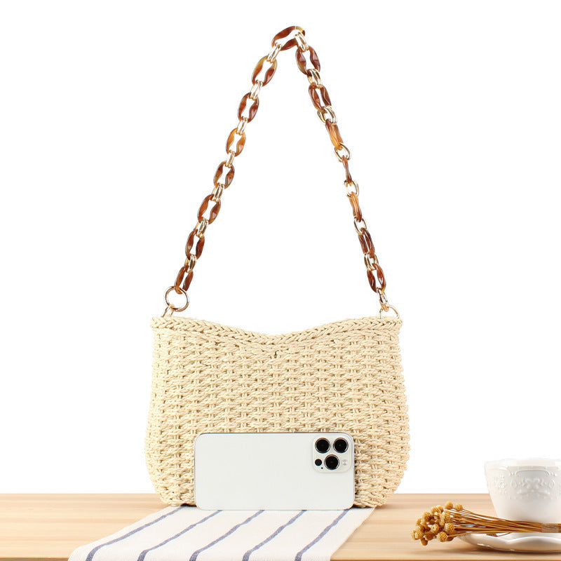 Modern straw bag with chain handle Skanto