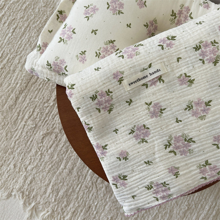 Unisex allsidig muslinteppe med blomstrete detaljer Skanto