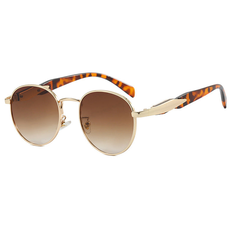 Dame rund solbrille med elegant, gullramme og UV-beskyttelse Skanto