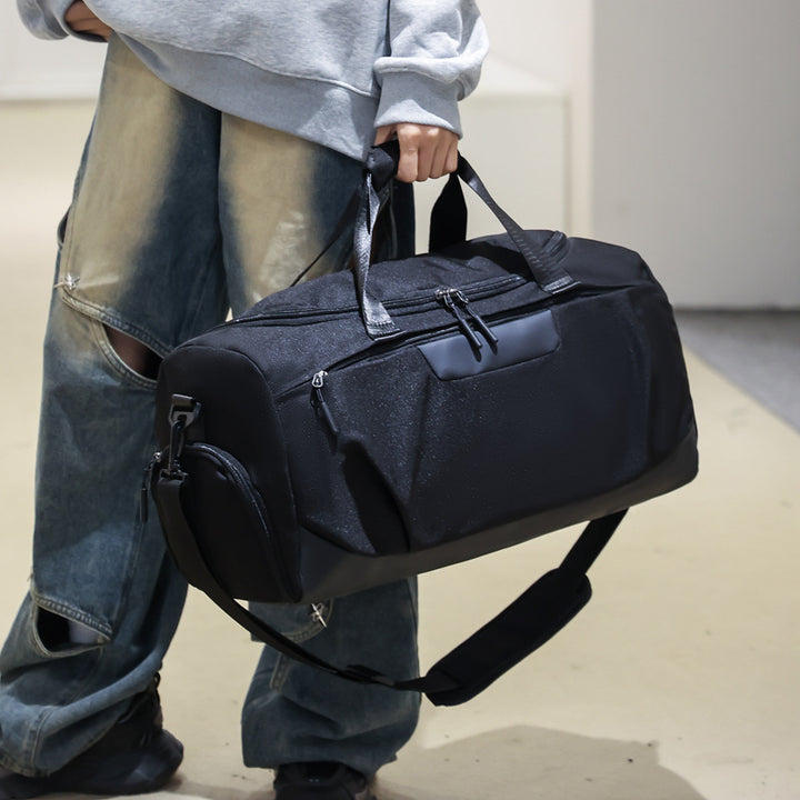 Sporty duffel bag with versatile storage and ergonomic carrying handles Skanto