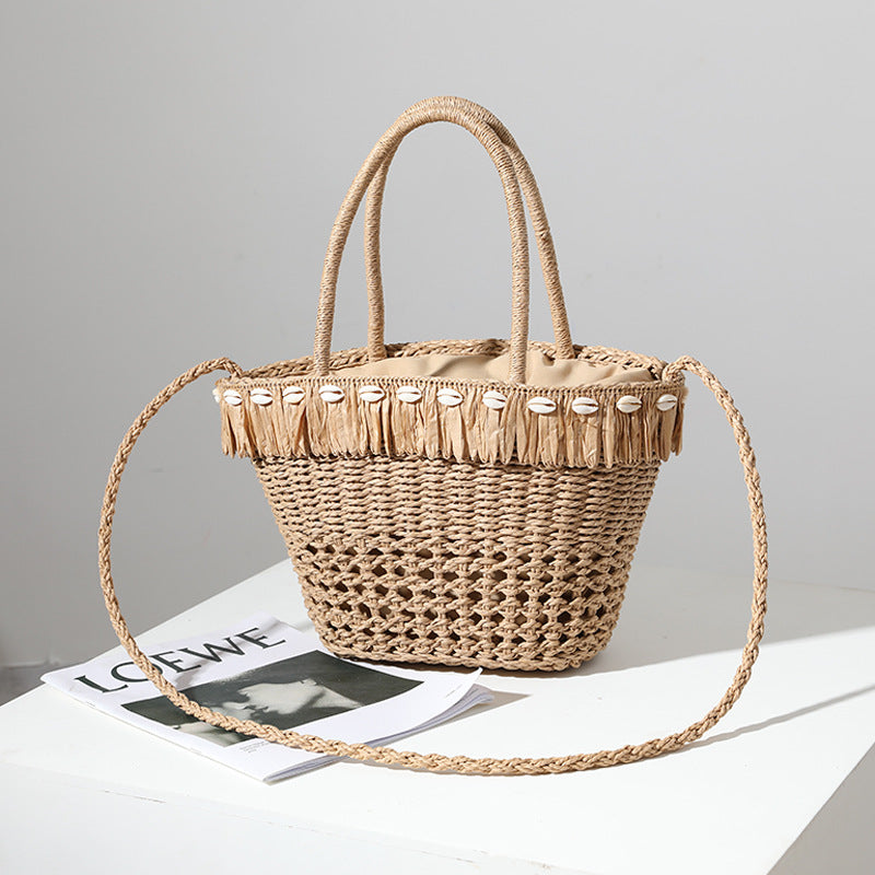 Braided straw bag with decorative tassel detail Skanto