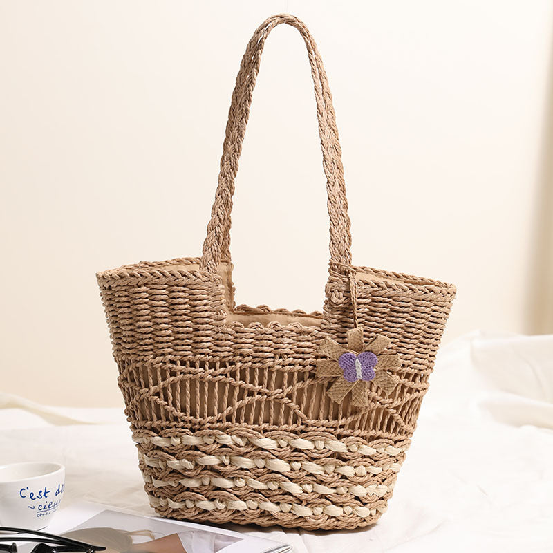 Braided basket bag with decorative floral appliqué Skanto