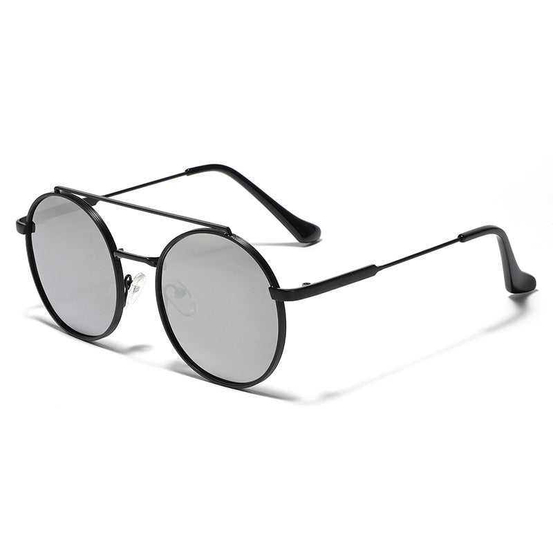 Dame rund solbrille med moteramme Skanto