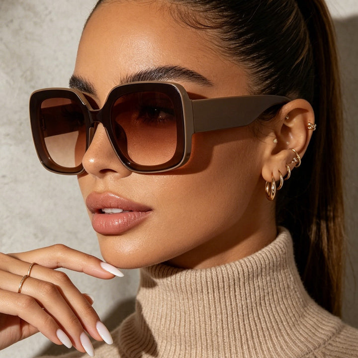 Dame firkantet solbrille med innovativt transparent rammedesign Skanto