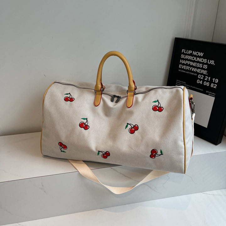 Sporty weekend bag with playful cherry pattern Skanto
