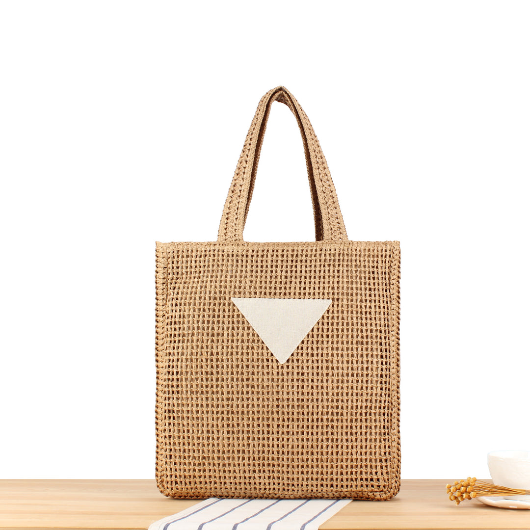 Håndveske laget av naturlig flette med minimalistiske detaljer Skanto