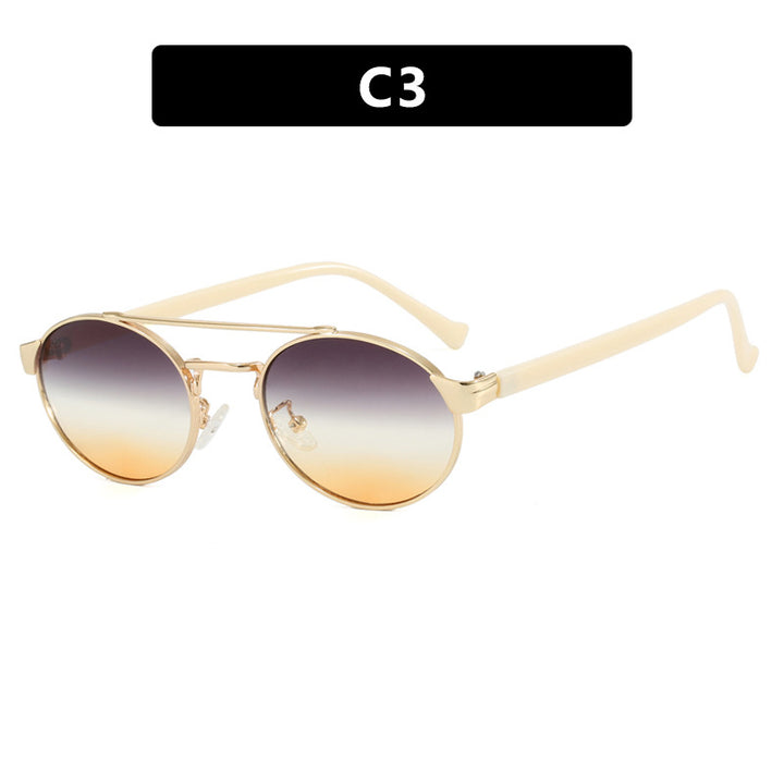 Women's fashionable sunglasses in stylish round design with gold accents Skanto