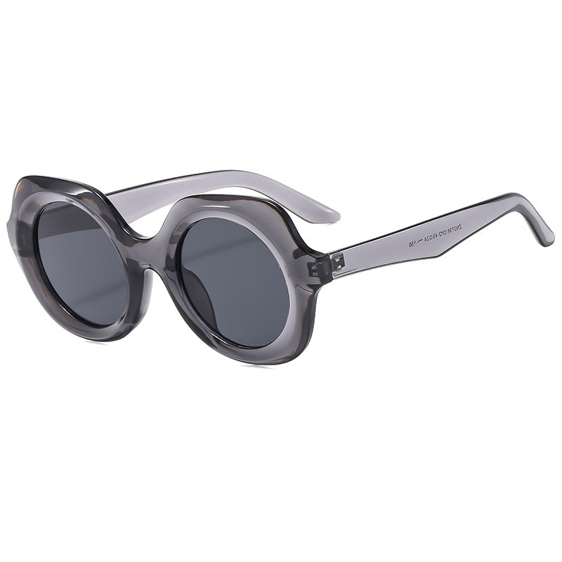 Dame oversized solbriller med stilige, buede rammer Skanto
