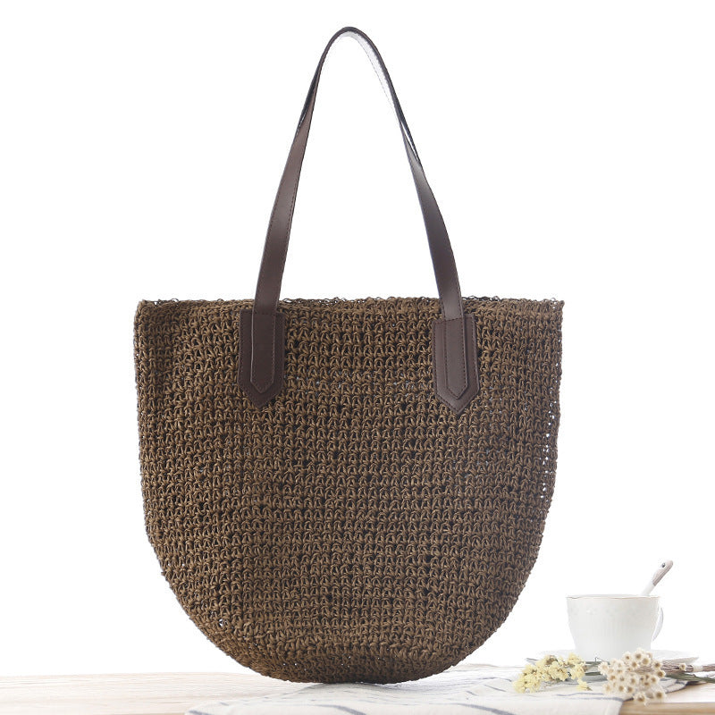 Woven natural material handbag with sturdy leather handles Skanto